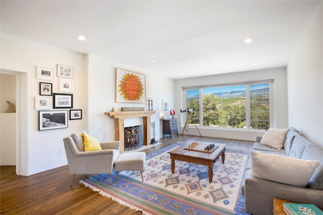 1103 Bishops Ldg, Santa Fe, NM 87501 - living area with wood finished floors, a fireplace with flush hearth, and recessed lighting
