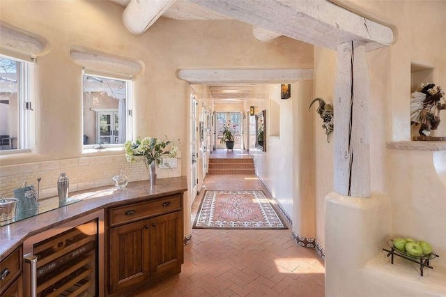 24 Paintbrush Cir, Santa Fe, NM 87506 - hall featuring wine cooler, brick flooring, and beamed ceiling
