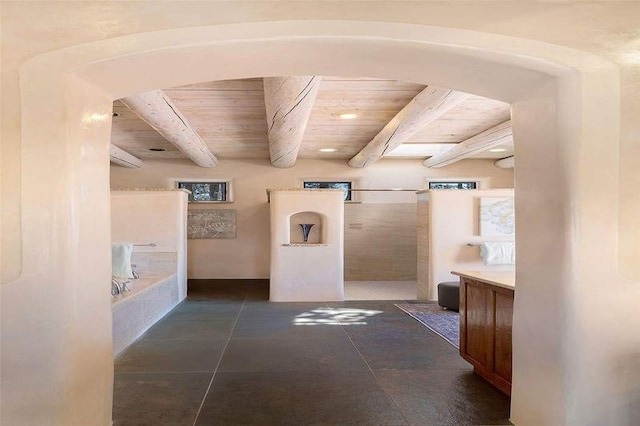 24 Paintbrush Cir, Santa Fe, NM 87506 - hall with a wooden ceiling with exposed beams, recessed lighting, arched walkways, and dark tile patterned flooring