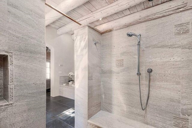 24 Paintbrush Cir, Santa Fe, NM 87506 - full bathroom featuring tiled shower, tile patterned floors, and a wood ceiling with exposed beams
