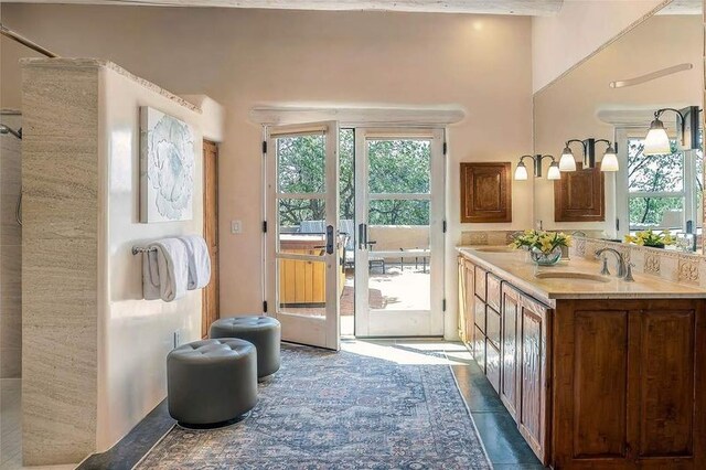24 Paintbrush Cir, Santa Fe, NM 87506 - bathroom featuring double vanity, a shower, and french doors