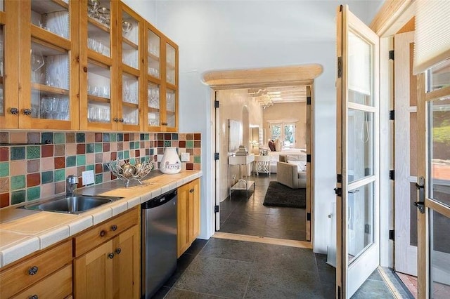 24 Paintbrush Cir, Santa Fe, NM 87506 - kitchen with dishwasher, tile counters, decorative backsplash, and glass insert cabinets
