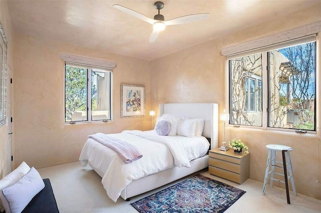 24 Paintbrush Cir, Santa Fe, NM 87506 - carpeted bedroom featuring a ceiling fan