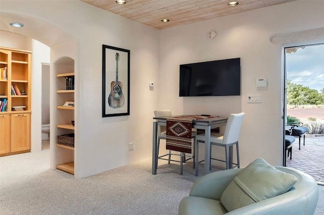 24 Paintbrush Cir, Santa Fe, NM 87506 - living area featuring carpet floors, recessed lighting, built in shelves, wood ceiling, and arched walkways