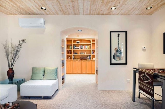24 Paintbrush Cir, Santa Fe, NM 87506 - sitting room with a wall mounted AC, wood ceiling, carpet, recessed lighting, and arched walkways