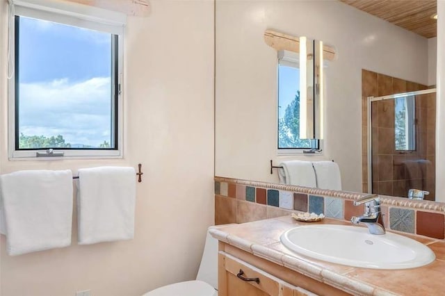 24 Paintbrush Cir, Santa Fe, NM 87506 - full bathroom with vanity, a stall shower, and tasteful backsplash