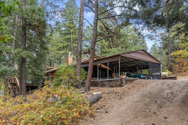 exterior space with an outbuilding and driveway