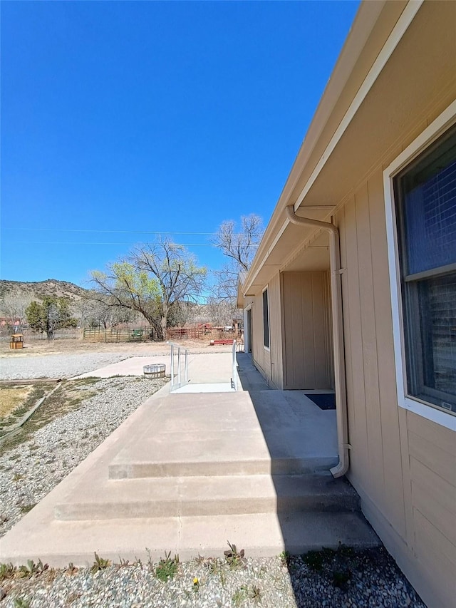 view of yard featuring a patio area and a mountain view
