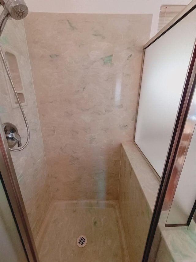 full bath featuring a stall shower