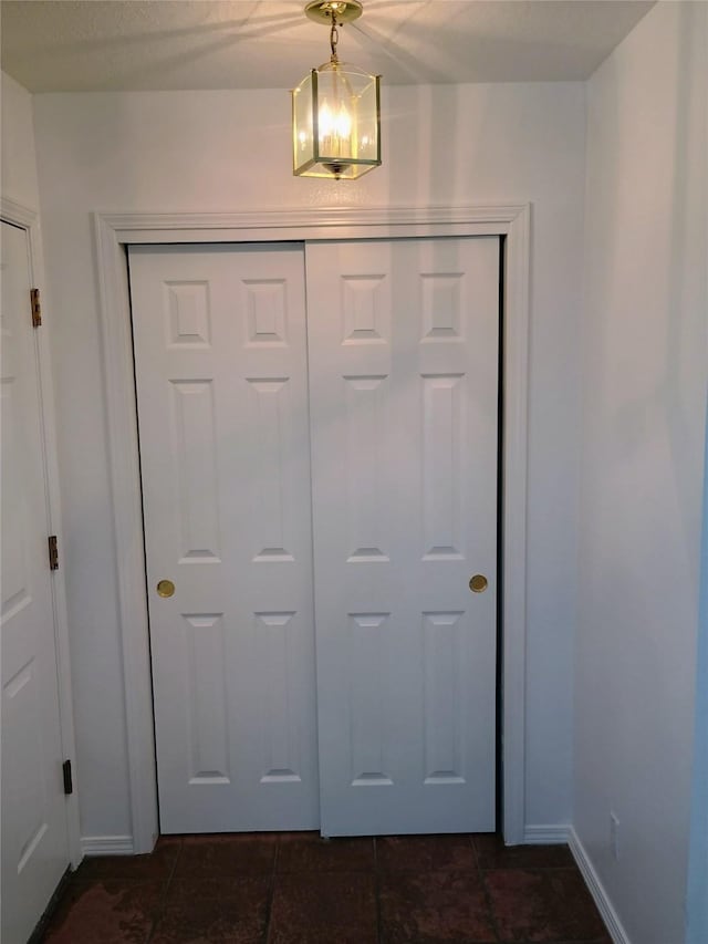 interior space featuring baseboards