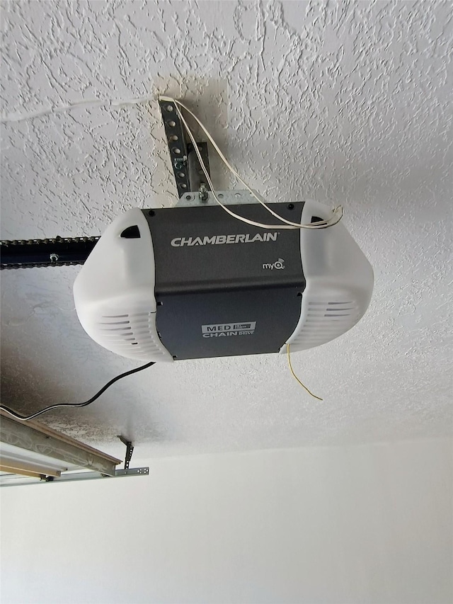 interior details with a textured ceiling and a garage door opener