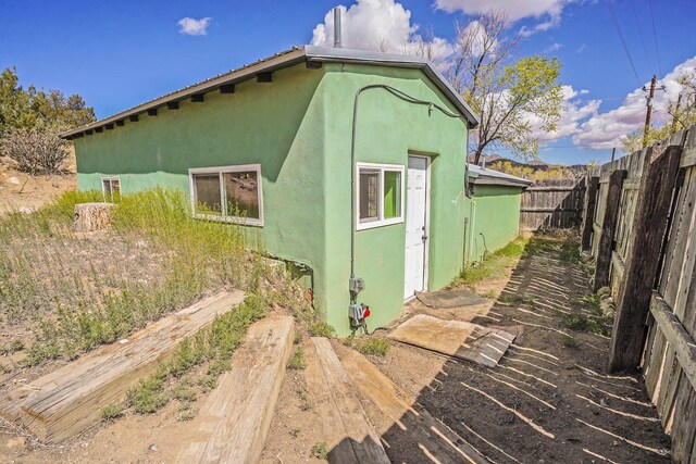 3112 Nm 14, Cerrillos, NM 87010 - view of property exterior featuring a fenced backyard and stucco siding