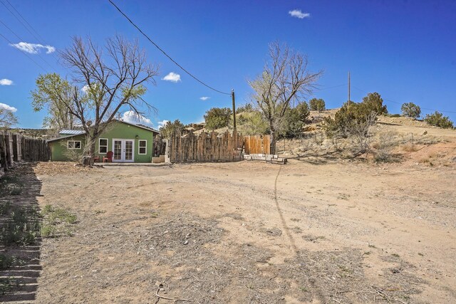 3112 Nm 14, Cerrillos, NM 87010 - view of yard with french doors and fence