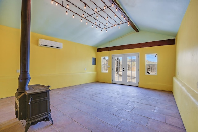 3112 Nm 14, Cerrillos, NM 87010 - unfurnished room featuring a wood stove, french doors, an AC wall unit, and vaulted ceiling with beams