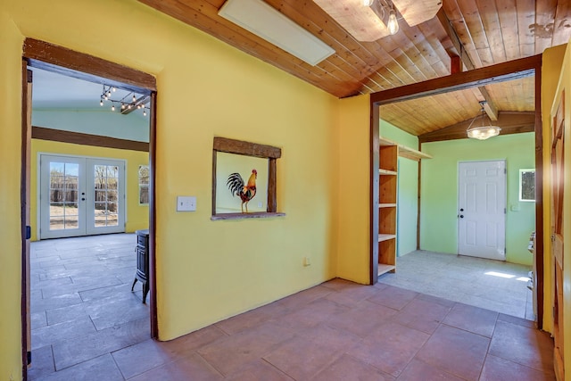 3112 Nm 14, Cerrillos, NM 87010 - unfurnished room featuring wood ceiling, french doors, and lofted ceiling with beams