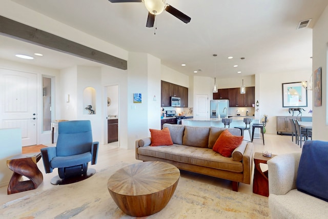 living room featuring recessed lighting, visible vents, and a ceiling fan