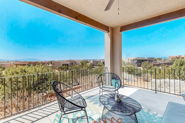 balcony featuring a ceiling fan