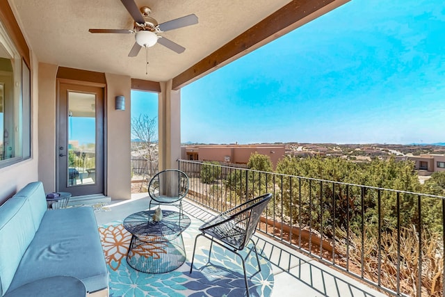 balcony featuring an outdoor living space and a ceiling fan