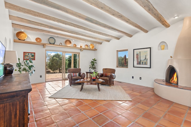 sitting room with beamed ceiling, a fireplace, and tile patterned flooring