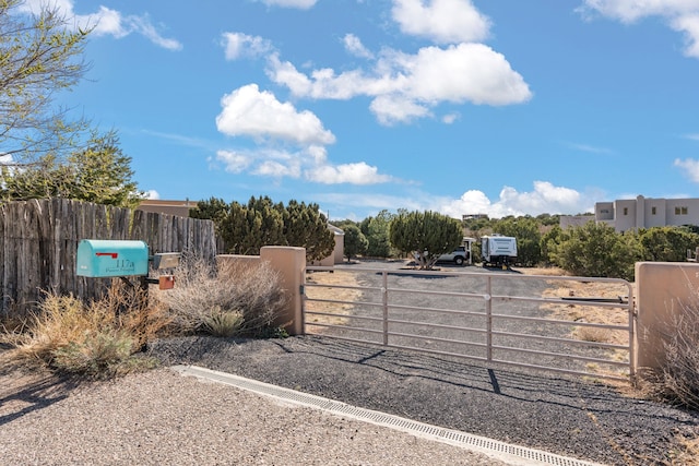 view of gate featuring fence