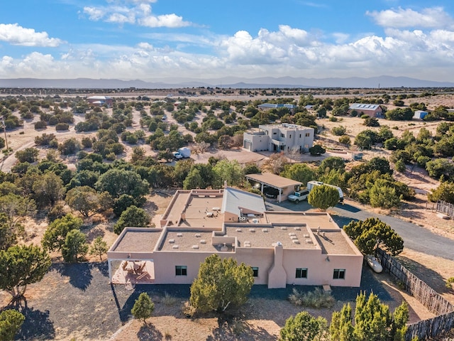 aerial view featuring a mountain view and view of desert