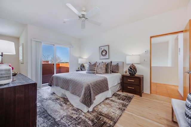 bedroom with access to exterior, light wood finished floors, ceiling fan, and baseboards
