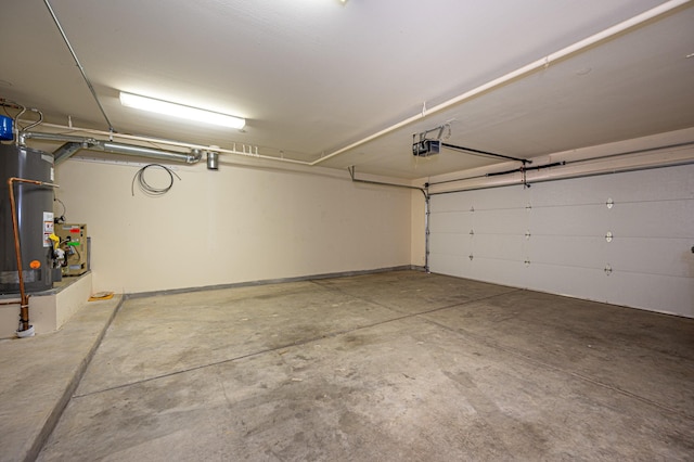 garage featuring gas water heater and a garage door opener