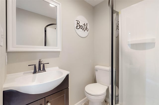 full bathroom featuring toilet, vanity, and a shower