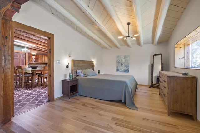 bedroom with a chandelier, light wood-style flooring, beamed ceiling, arched walkways, and wood ceiling