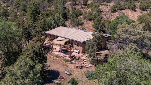 bird's eye view featuring a forest view