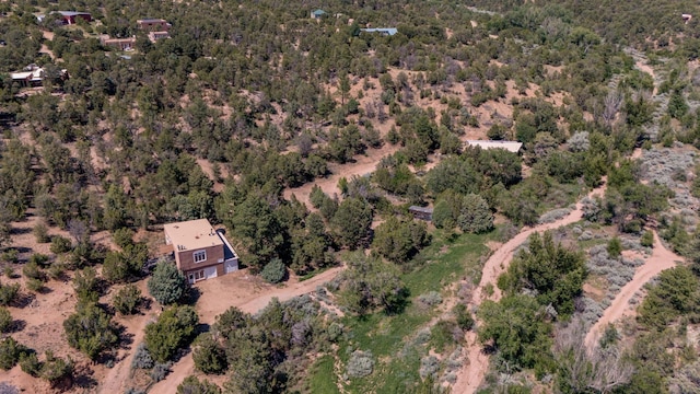 aerial view featuring a view of trees