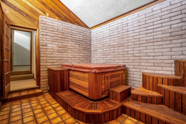 view of sauna / steam room with brick wall