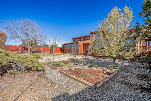 view of yard featuring a garden and fence