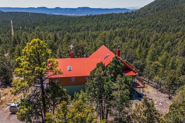 387 County Road B64, Pecos, NM 87552 - aerial view of property and surrounding area with a heavily wooded area and mountains