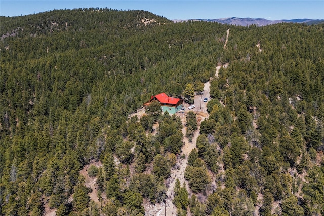 387 County Road B64, Pecos, NM 87552 - view of property location with a heavily wooded area and a mountain backdrop