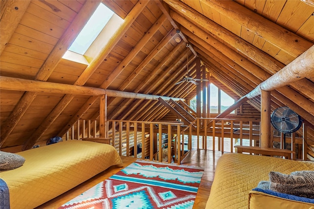 387 County Road B64, Pecos, NM 87552 - bedroom featuring wooden ceiling, wood finished floors, and a skylight