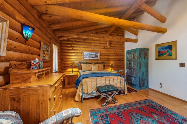 387 County Road B64, Pecos, NM 87552 - bedroom featuring log walls and wood finished floors