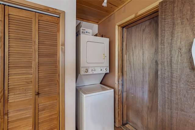 387 County Road B64, Pecos, NM 87552 - laundry room featuring stacked washer and clothes dryer and wood ceiling