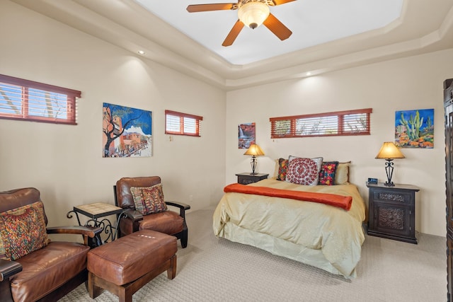 bedroom with recessed lighting, carpet flooring, a ceiling fan, and a raised ceiling
