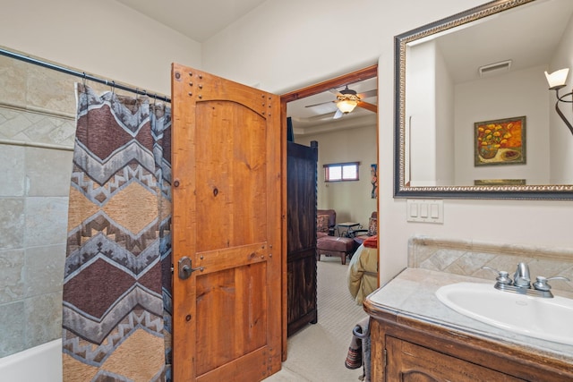 ensuite bathroom with visible vents, ensuite bathroom, a shower with shower curtain, ceiling fan, and vanity