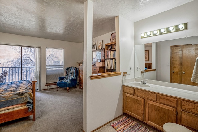 bathroom with vanity and a textured ceiling