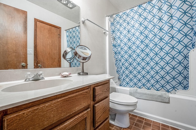 full bathroom featuring tile patterned flooring, shower / bathtub combination with curtain, vanity, and toilet