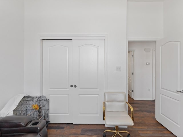 sitting room with dark wood-style floors