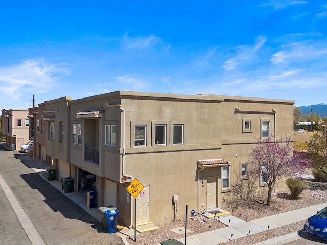 view of building exterior featuring a mountain view