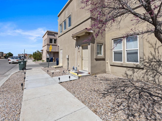exterior space featuring stucco siding