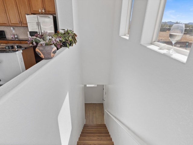 stairs with wood finished floors