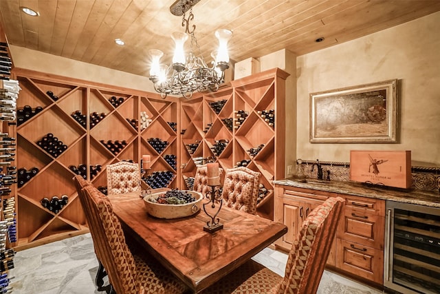 wine room with a sink, beverage cooler, wood ceiling, an inviting chandelier, and recessed lighting