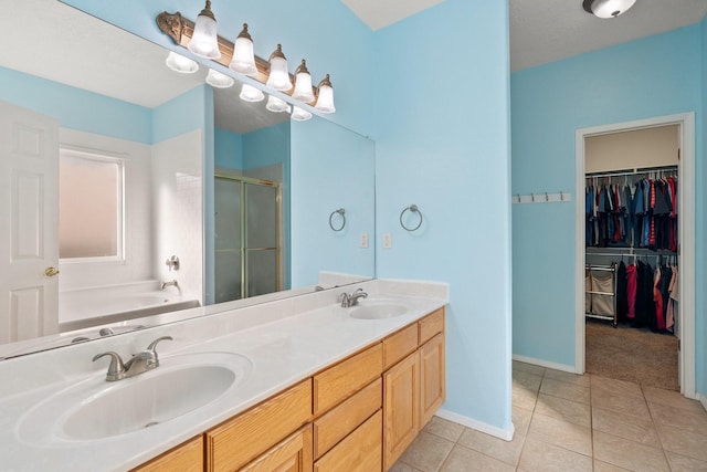 10335 Dunbar St NW, Albuquerque, NM 87114 - full bathroom featuring tile patterned flooring, a sink, double vanity, and a stall shower