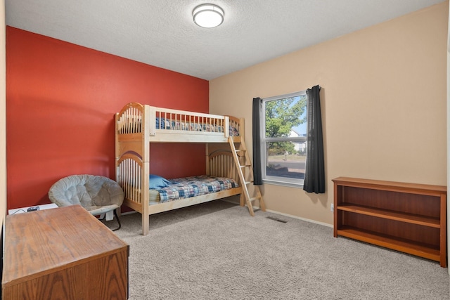 10335 Dunbar St NW, Albuquerque, NM 87114 - carpeted bedroom with a textured ceiling, visible vents, and baseboards