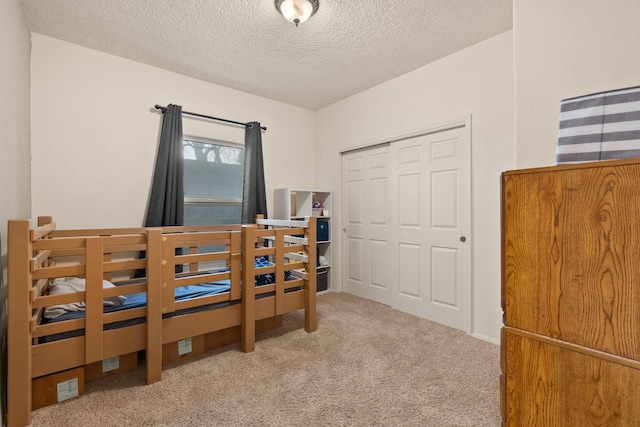 10335 Dunbar St NW, Albuquerque, NM 87114 - carpeted bedroom with a textured ceiling and a closet